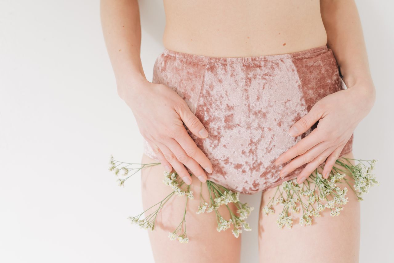 The Art of Drawing Readers In: Your attractive post title goes here Close-up of a female model in velvet underwear with delicate flowers accentuating the garment.